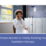 A woman receiving IV hydration therapy in a comfortable clinic setting, smiling as she relaxes during the session.